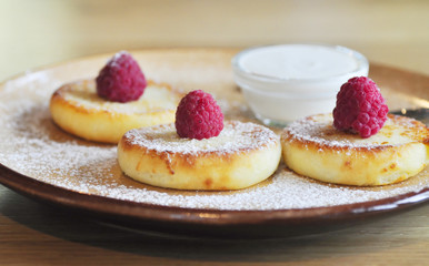Homemade cheese pancakes on a plate 