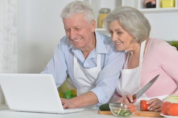 senior man and woman  in the kitchen