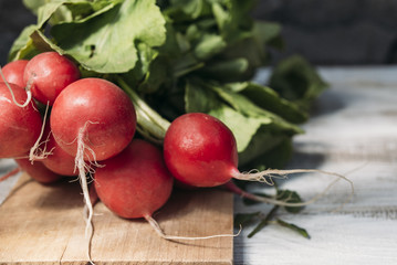 Radishes on a chopping board