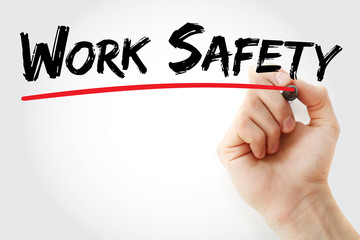 Hand writing Work Safety with marker, business concept background