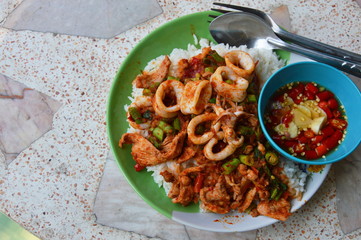 stir-fried curry squid and pork on plain rice