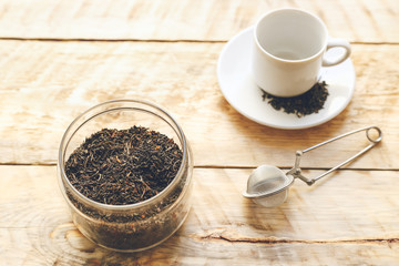 Tea set on the wooden table at sunny morning