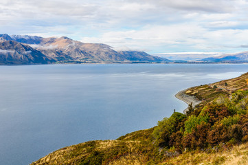 Fototapeta na wymiar View of a lake near Wanaka in Southern Lakes, New Zealand