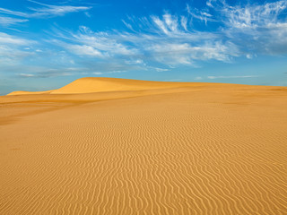 Fototapeta na wymiar Desert sand dunes on sunrise