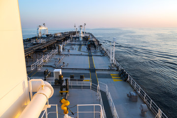 Oil tanker deck during sunset.