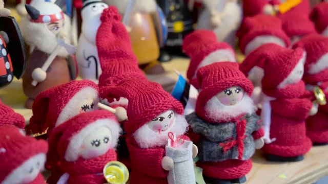 Little Christmas elves stuffed toys being displayed on the streetside