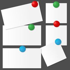 Vector white note paper with red, blue, green magnets on a black