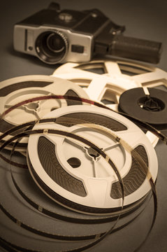 Still life of 8mm cine film reels and movie cinema camera.
