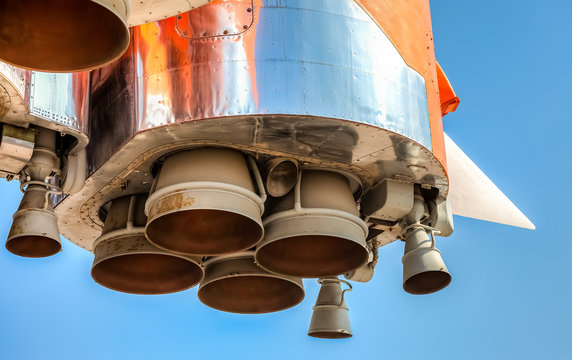 Detail of space rocket engine against the blue sky