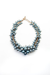 necklace of beads and gold chains isolated