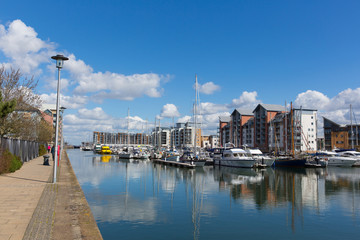 Fototapeta na wymiar Portishead Somerset UK marina with boats and residential buildings