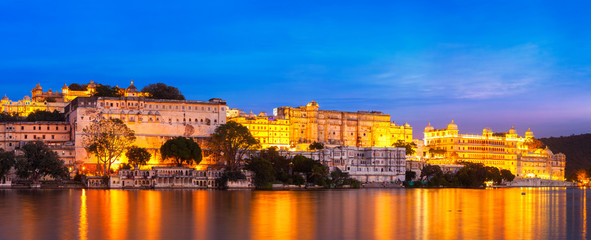 Fototapeta na wymiar Udaipur City Palace in the evening panoramic view. Udaipur, Indi