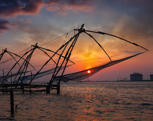 Fototapeta na wymiar Chinese fishnets on sunset. Kochi, Kerala, India