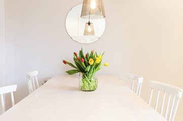bunch of tulips on the kitchen table
