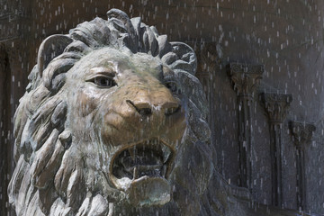 Fototapeta na wymiar Lion statue fountain in downtown of Skopje, Macedonia