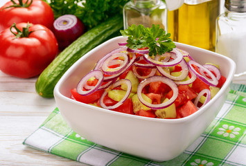 Salad with tomatoes, cucumbers and onion.
