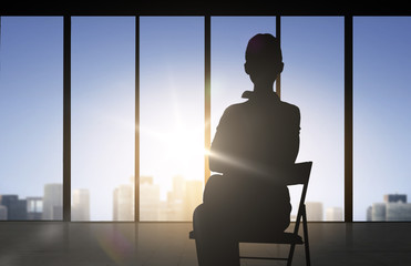 Fototapeta na wymiar silhouette of business woman sitting on chair