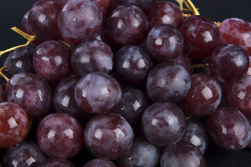Red grape with water drops, closeup background
