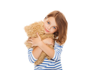 cute little girl hugging teddy bear