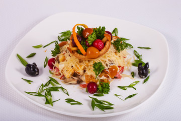 Fresh salad assorted with mushrooms, vegetables, meat, greens and cheese 
