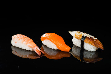 assortment of nigiri sushi on a dark background © smspsy