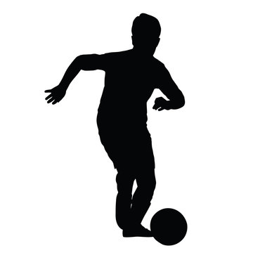 Young soccer player silhouette, kid plays soccer or football. Fr