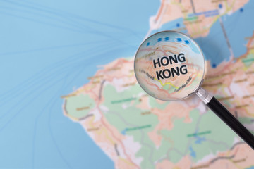 Consultation with magnifying glass map of Hong Kong