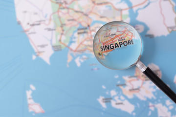 Consultation with magnifying glass map of Singapore