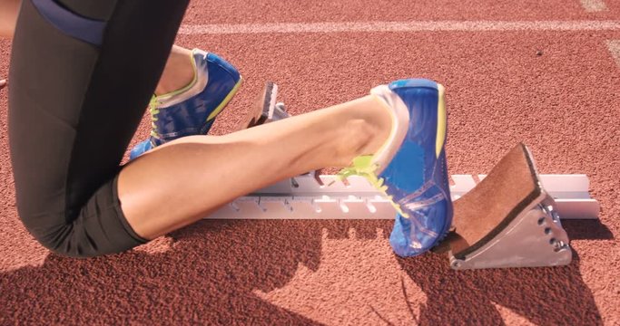 Athlete woman waiting in the starting block