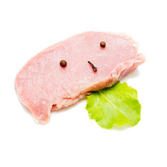 Raw beef steak with garlic and black pepper on white background
