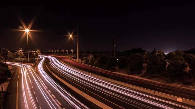 A night time lapse of the traffic jam in the highway
