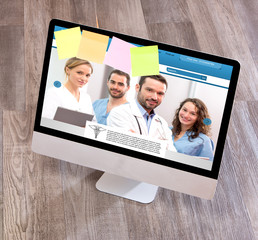 Wood doctor's desk in high definition with laptop, tablet and mo