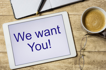 tablet with we wantr You on table with coffee