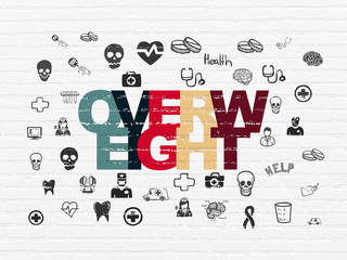 Healthcare concept: Overweight on wall background