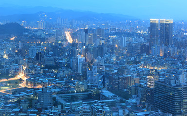 Obraz premium Panoramic night scene of Taipei downtown, View from Taipei 101 ~ A Blue and Gloomy Night in Taipei ~ Aerial view of Taipei City in dusktower !