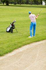 Man playing golf