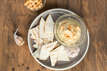 Healthy Homemade Creamy Hummus with Olive Oil and  Chips
