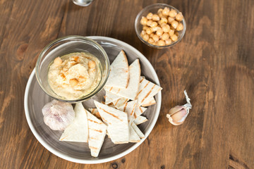 Healthy Homemade Creamy Hummus with Olive Oil and  Chips