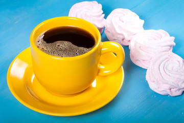 Fresh pink homemade zephyr - marshmallow and cup of coffee on bl