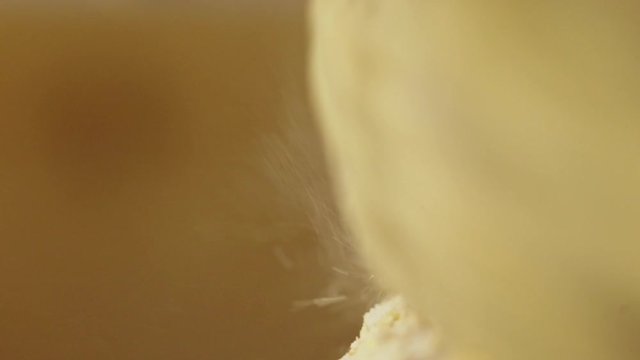 Macro shot of historic hand-driven millstone grinding wheat