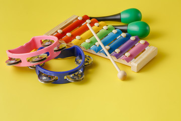Musical instruments collection on yellow background