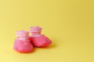 baby booties on a yellow background