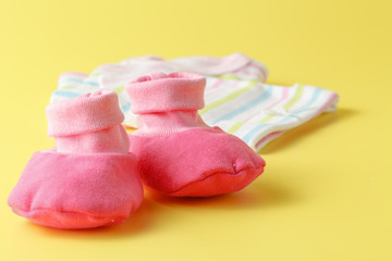 Baby clothing on a plain bright background
