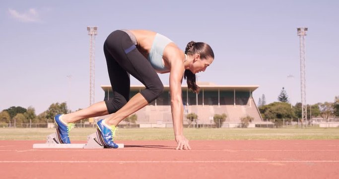 Athlete woman starting running 