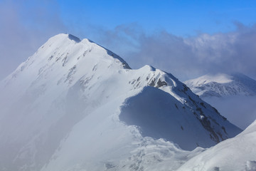 Fototapeta na wymiar Moldoveanu Peak in winter