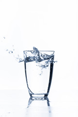 water splashing from glass isolated on white background
