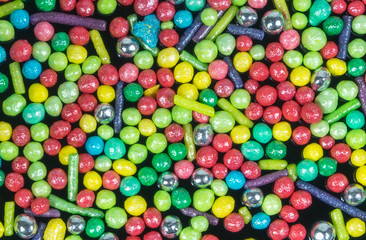 Fototapeta na wymiar Candy sprinkles, in full-frame background. view from above.