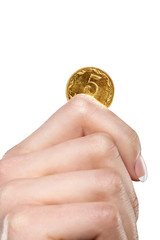 hand holding golden coin