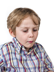 blond kid looking down.