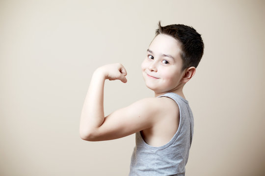 kid flexing biceps